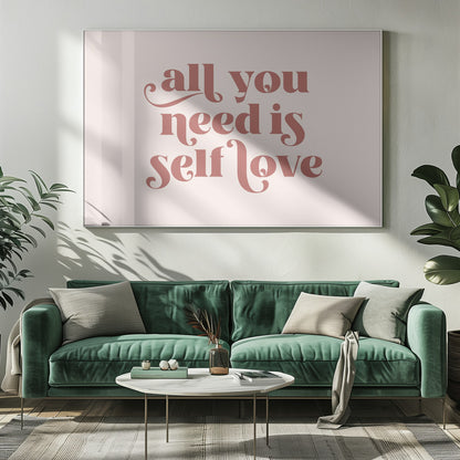 A framed art print with the phrase 'all you need is self love' in a stylish, dusty rose serif font on a light pink background. The artwork is enclosed in a simple silver frame. Poster