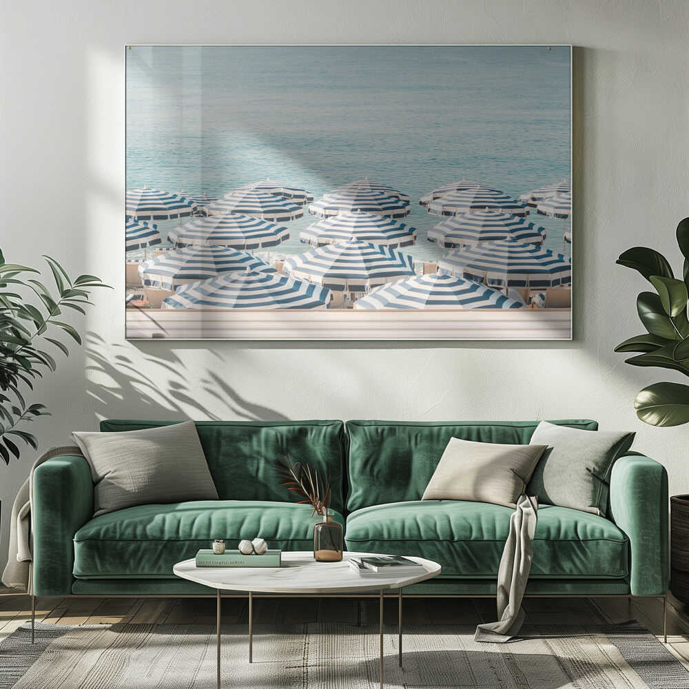 A serene beach scene viewed from above, featuring a multitude of blue and white striped umbrellas lining the shore in front of a calm, turquoise sea. Artwork