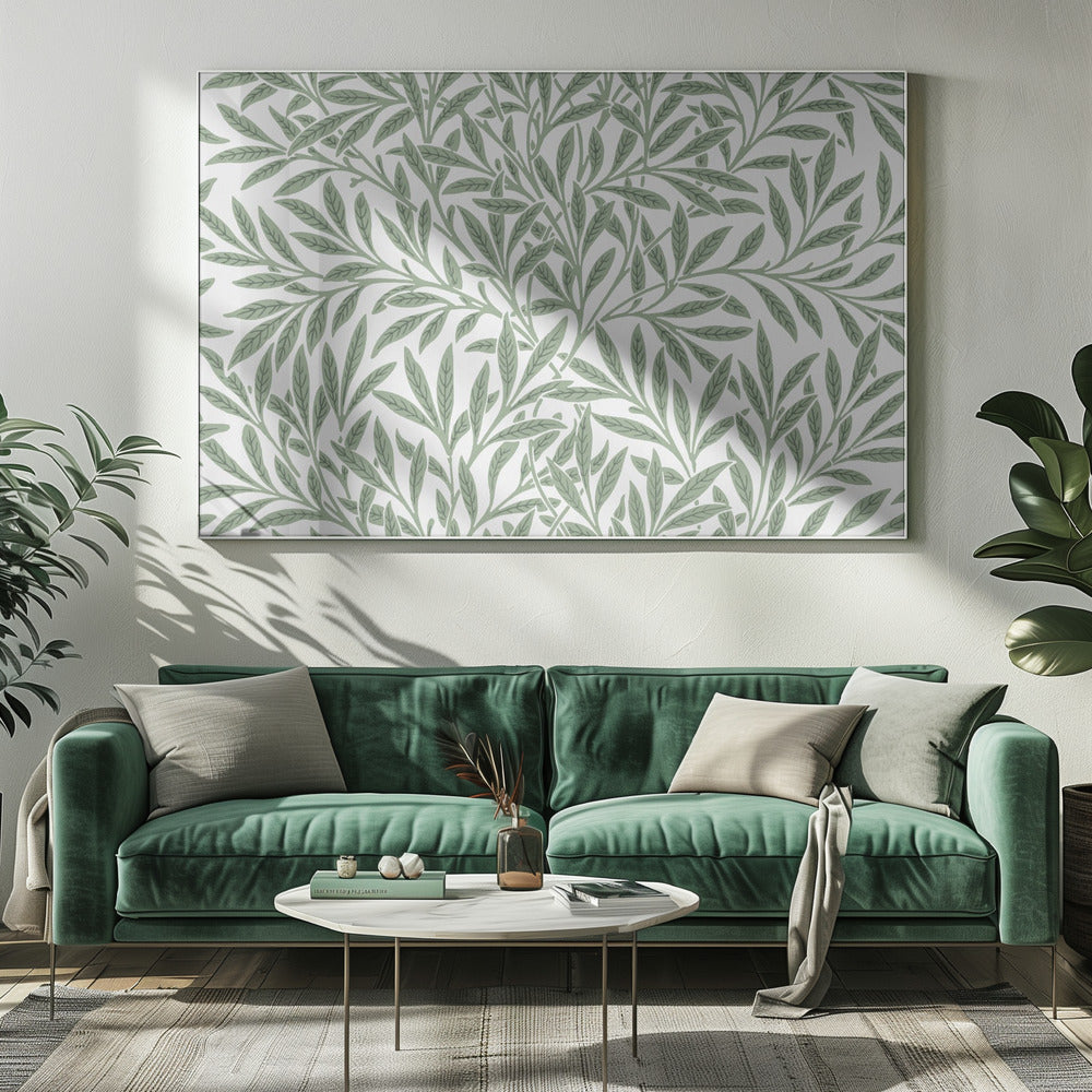 A framed art print with a repeating pattern of sage green leaves and branches on a white background. The style is elegant and inspired by nature, and the print is housed in a simple silver frame. Poster
