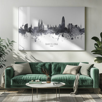 A framed black and white watercolor silhouette of the Barcelona, Spain skyline. Famous landmarks like the Sagrada Familia and Torre Glòries are visible. The word 'BARCELONA' is printed below the cityscape against a clean white background. Poster