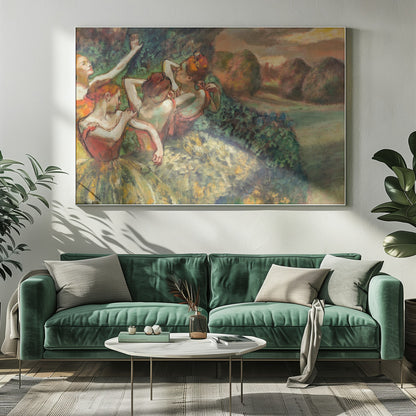 An impressionistic painting of four ballerinas in a lush outdoor setting. Dressed in orange bodices and yellow-green tutus, they are captured in candid moments of rest and preparation against a backdrop of green foliage and a warm sunset landscape. Poster