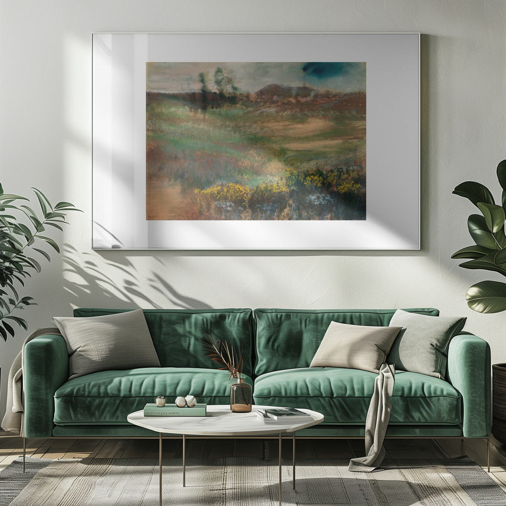 A framed impressionistic painting of a rolling landscape. In the foreground, there are bushes with yellow flowers. The midground features swaths of green and brown grasses, leading to a line of trees and hills in the background under a moody, overcast sky. The artwork is set in a white mat within a silver frame. Artwork