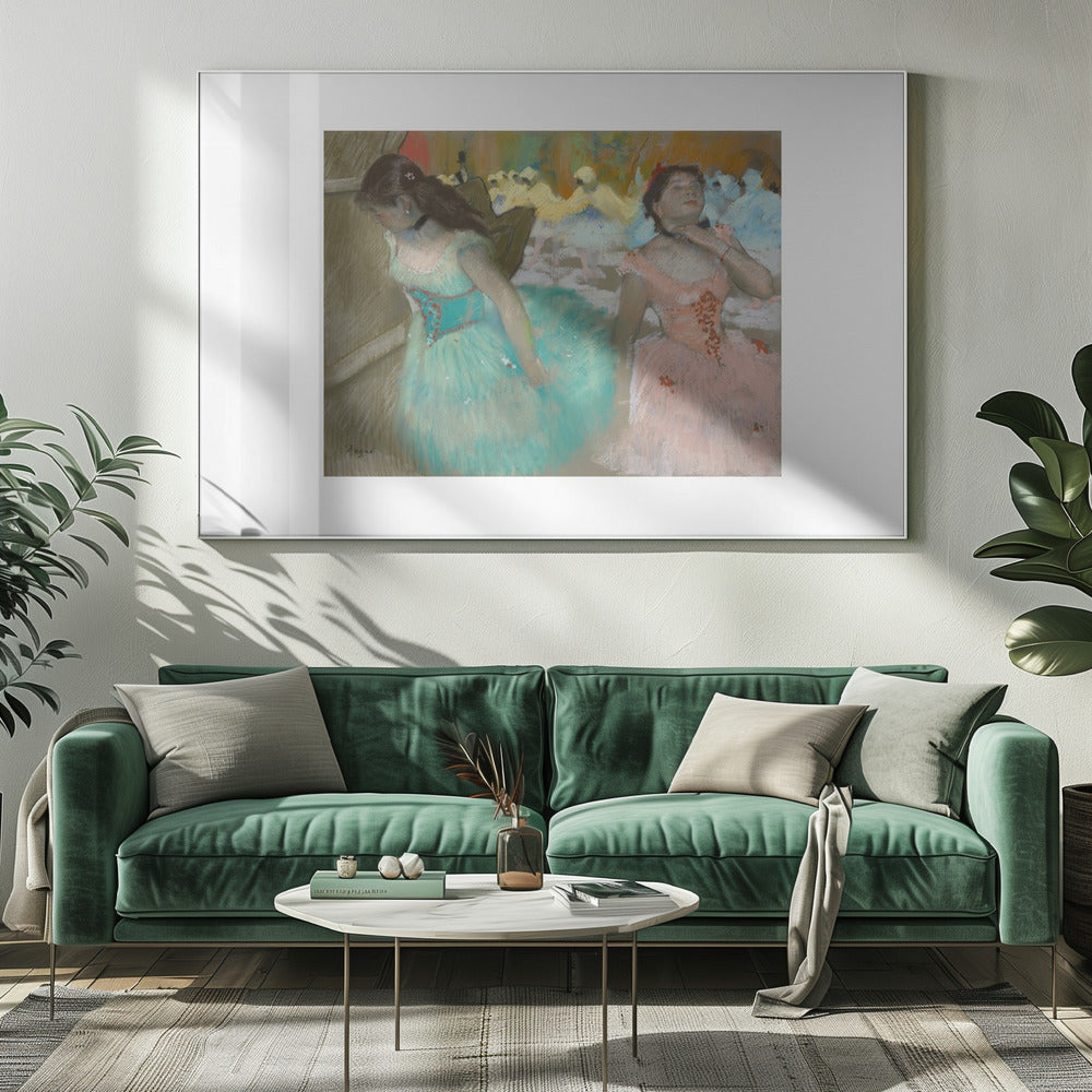 An impressionist pastel painting by Edgar Degas of two ballerinas backstage. One in the foreground wears a teal tutu and looks down, while another beside her in a pink tutu adjusts her choker. Other dancers are visible in the background under warm stage light. Poster