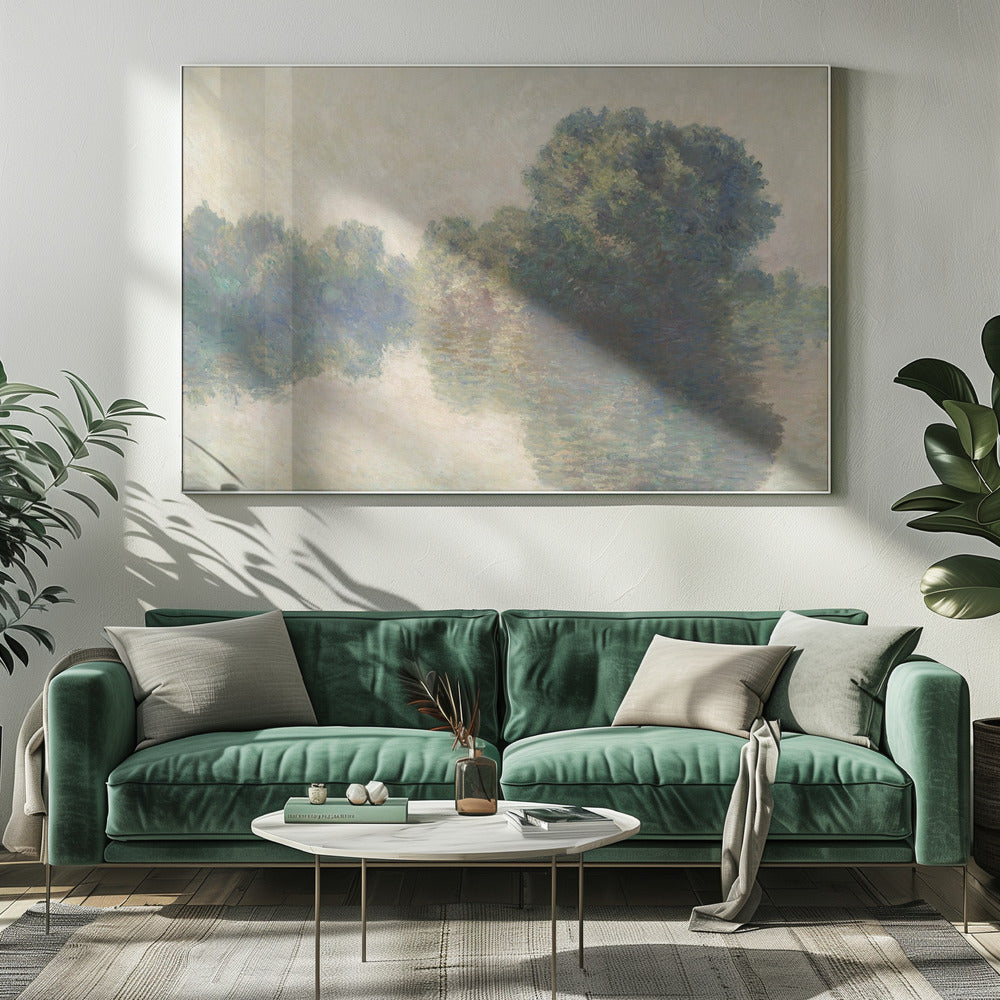 An impressionist painting of lush green trees on a riverbank, their forms blurred and reflected in the calm, hazy water below. The scene is rendered in soft, muted tones, creating a serene and atmospheric quality, and is presented in a simple silver frame. Artwork