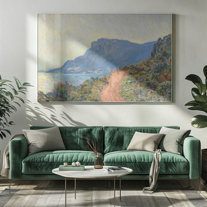 An Impressionist painting by Claude Monet titled 'Cap Martin, near Menton', depicting a sunlit coastal scene. A reddish-brown path winds along a vibrant, brush-covered cliff in the foreground, overlooking the blue Mediterranean Sea. A large, hazy blue mountain dominates the background under a pale yellow sky. Decor