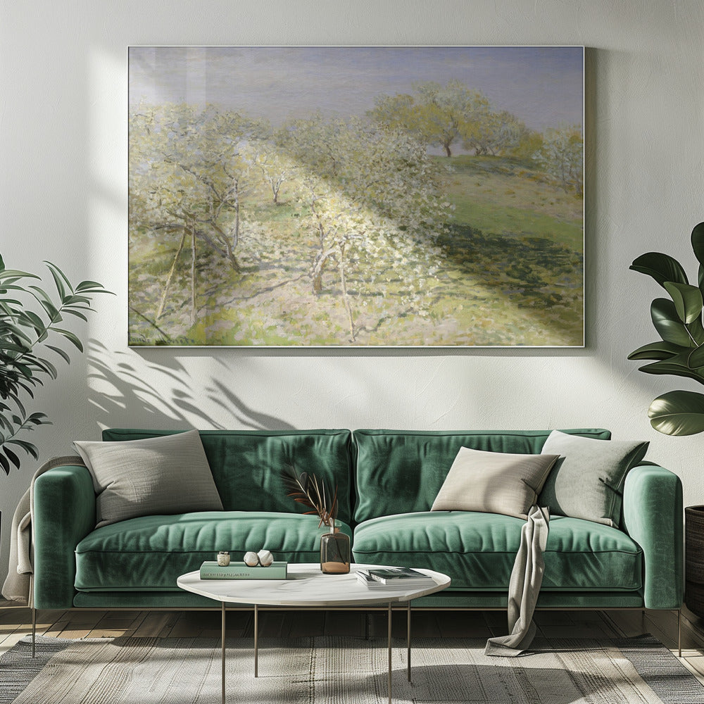 An impressionist painting of an orchard in full bloom, with white and yellow blossoms covering the trees. The orchard is set on a rolling green hillside under a pale, hazy sky, with soft shadows cast on the grass. The artwork is presented in a silver frame. Wall Art