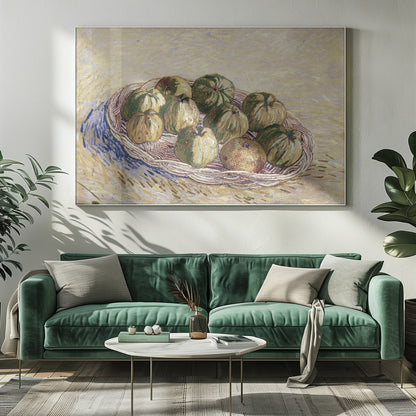 A post-impressionist still life painting by Vincent van Gogh showing a woven basket full of green and yellow apples. The background is a textured pale yellow, and the artist's signature is visible in the bottom left. The artwork is presented in a silver frame. Poster