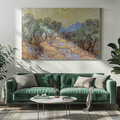 A framed Post-Impressionist painting by Vincent van Gogh depicting an olive grove under a bright yellow sun and sky. The olive trees have gnarled brown trunks and green leaves, set against a rolling landscape of ochre and lavender shadows. In the distance, blue mountains rise against the vibrant sky. The entire scene is painted with thick, energetic brushstrokes. Decor