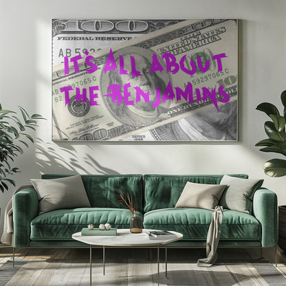 A pop art piece featuring a close-up of a one-hundred-dollar bill. The phrase 'IT'S ALL ABOUT THE BENJAMINS' is written across the image in a messy, graffiti-style font in a vibrant magenta color. The artwork is set within a silver frame. Wall Art