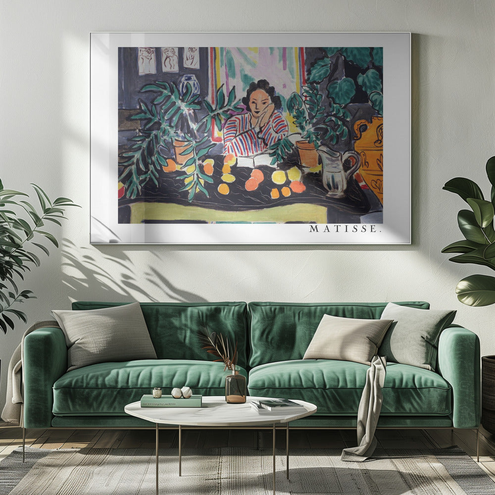 A framed print of the painting 'Woman with a Book' by Henri Matisse. The artwork features a woman in a red, white, and blue striped shirt sitting at a dark table filled with potted green plants and colorful fruit. She rests her head on her hand, looking out from the painting in a Fauvist style with bold colors and expressive brushwork. Poster