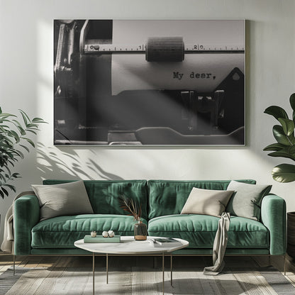 A close-up, black and white photograph of a vintage typewriter. A sheet of white paper is loaded, and the words 'My dear,' have just been typed, creating a sense of nostalgia and romance. The image is enclosed in a silver frame. Wall Art