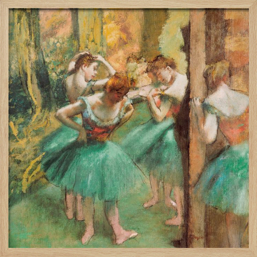 An impressionist painting of four ballet dancers in green tutus backstage. The dancers are adjusting their costumes and hair against a warm, painterly background of yellow, orange, and brown tones. The artwork is displayed in a light wood frame. Wall Art
