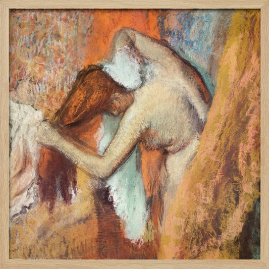 A framed impressionist pastel drawing by Edgar Degas showing a nude woman from the back, bending over to dry her neck with a towel. The artwork is characterized by its warm color palette of oranges, browns, and yellows, with textured, visible strokes. Decor