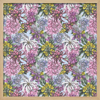 A framed artwork displaying a dense, repeating floral pattern with detailed illustrations of pink, purple, blue, white, and yellow flowers on a light blue background, encased in a simple light wood frame. Decor
