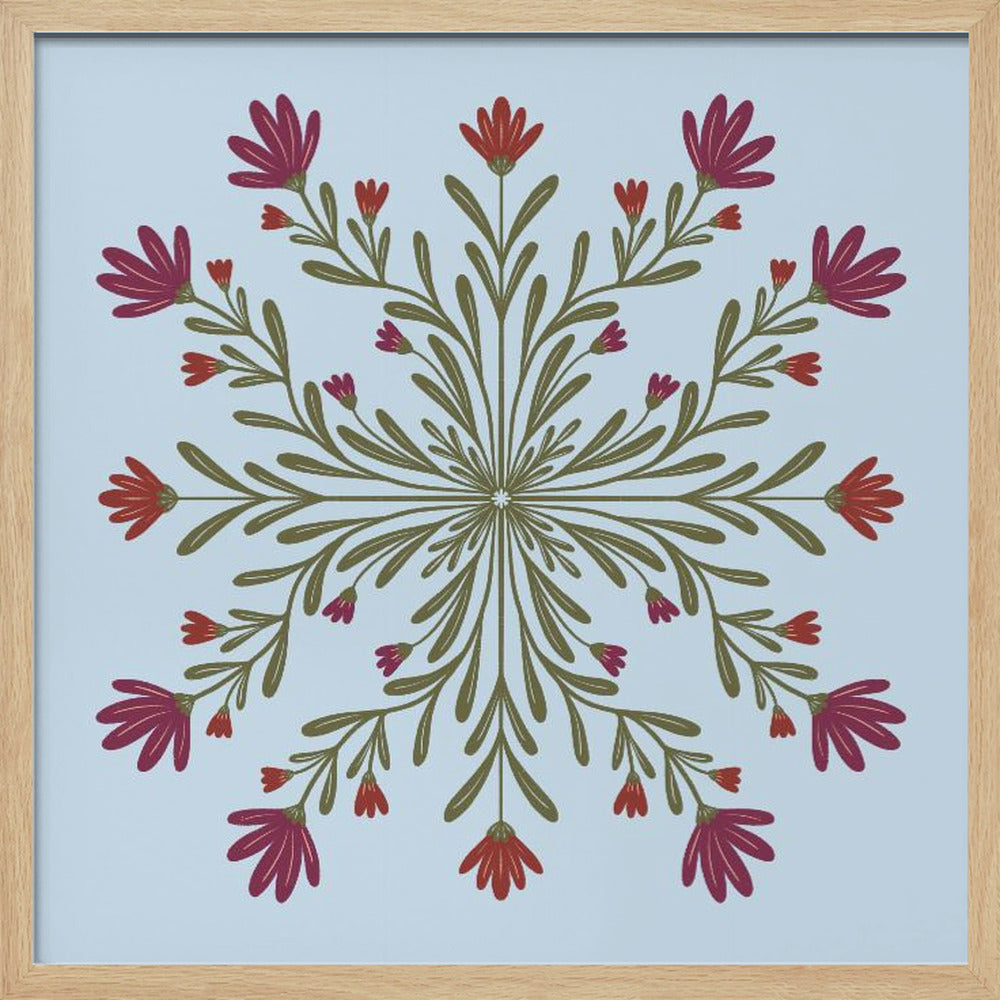A framed art print with a symmetrical floral mandala on a light blue background. Olive green stems and leaves radiate from the center, blooming with magenta and red flowers. The artwork is enclosed in a light wood frame. Wall Art