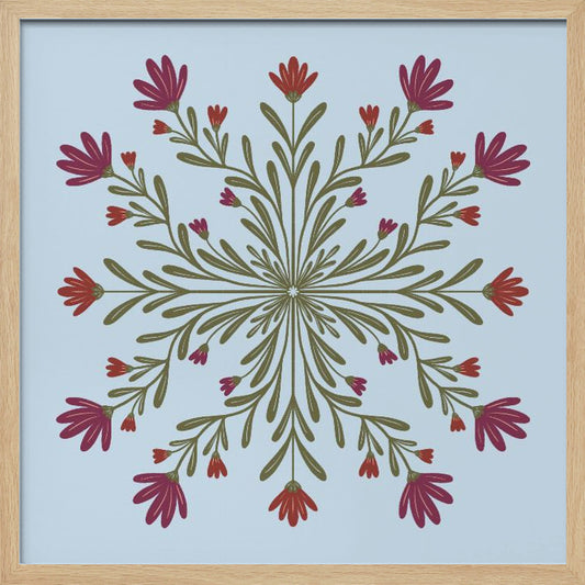 A framed art print with a symmetrical floral mandala on a light blue background. Olive green stems and leaves radiate from the center, blooming with magenta and red flowers. The artwork is enclosed in a light wood frame. Wall Art