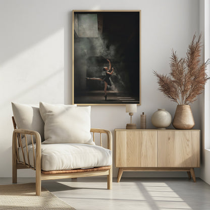 A ballerina in a black tutu gracefully performs an arabesque in a vast, dark, industrial space filled with smoke, dramatically illuminated by shafts of light from above. Poster