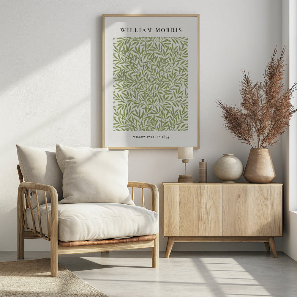A framed art print of William Morris's 'Willow Pattern 1874'. The print features an intricate, repeating pattern of green willow branches and leaves on an off-white background, with the artist's name and pattern title in black text above and below the design. Print
