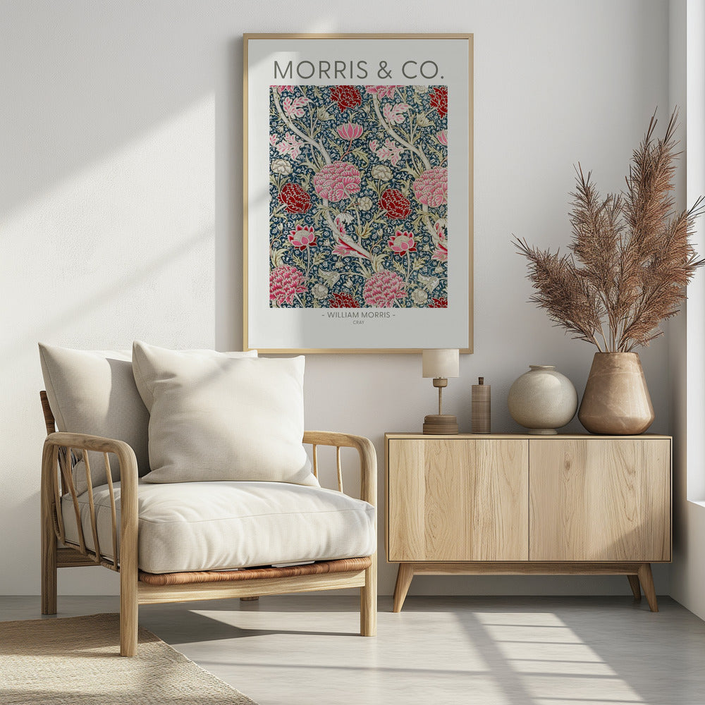 A framed art print of William Morris's 'Cray' pattern, featuring a dense floral design with large pink and red stylized flowers and foliage on a dark navy blue background. The text 'MORRIS & CO.' is above the pattern, and '- WILLIAM MORRIS - CRAY' is below. Artwork