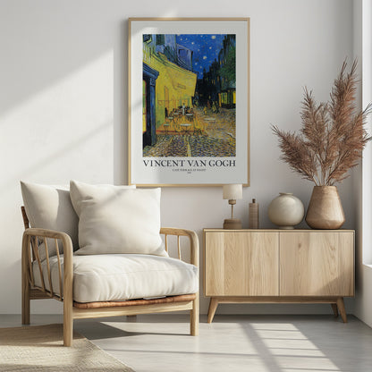 A framed art print of Vincent van Gogh's painting, 'Café Terrace at Night'. The post-impressionist artwork shows a brightly lit yellow café with patrons at tables on a cobblestone street, set against a deep blue, star-filled night sky. The text 'VINCENT VAN GOGH', 'CAFÉ TERRACE AT NIGHT', and '- 1888 -' is below the painting. Poster