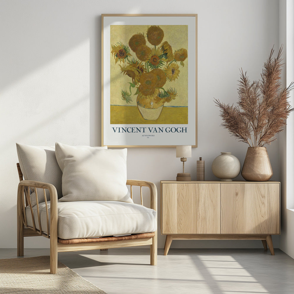 A poster of Vincent van Gogh's 'Sunflowers' painting, featuring a yellow vase with sunflowers against a yellow background. The poster has a white border with the text 'VINCENT VAN GOGH' and is set in a black frame. Poster