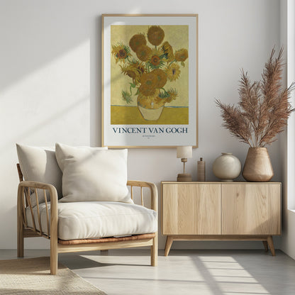 A poster of Vincent van Gogh's 'Sunflowers' painting, featuring a yellow vase with sunflowers against a yellow background. The poster has a white border with the text 'VINCENT VAN GOGH' and is set in a black frame. Poster