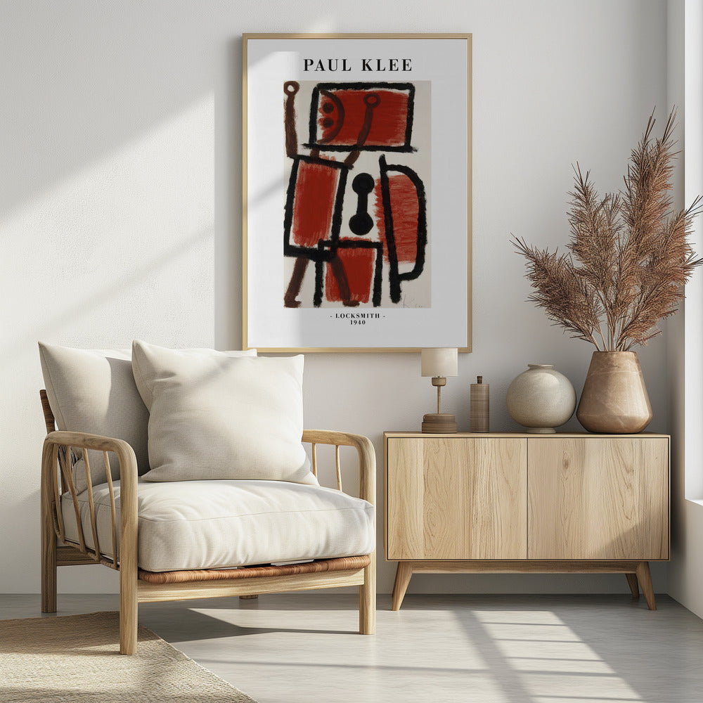 A framed art print of Paul Klee's 1940 painting 'Locksmith'. The abstract artwork features a composition of thick black lines and blocks of red and brown paint on a cream background, resembling a figure. The poster includes the text 'PAUL KLEE' at the top and '- LOCKSMITH - 1940' at the bottom. Artwork