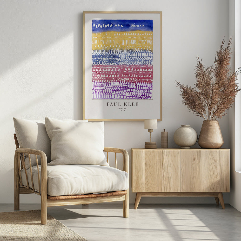 A framed art print of Paul Klee's 1928 watercolor painting 'Old City.' The abstract piece features horizontal bands of color, from top to bottom: a dark blue sky, a yellow section with building-like patterns, and layers of intricate lattice-like designs in blue, magenta, and purple. Artwork