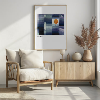 A framed art print of a Paul Klee painting featuring a geometric composition of rectangles in various shades of blue and purple. A single, stylized orange tree with a round top stands out against a white square. The artist's name, 'KLEE.', is printed in the lower left corner on the white mat. Decor