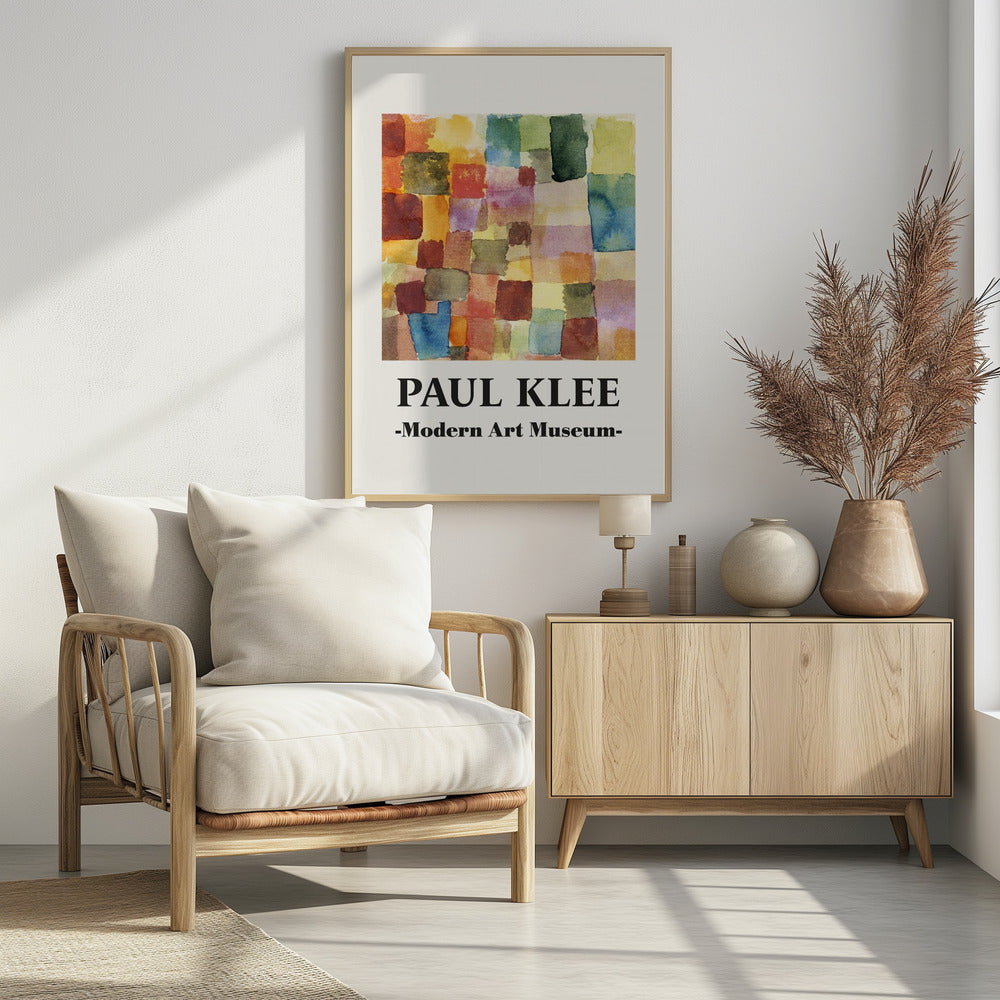 A framed museum poster for a Paul Klee exhibition at the Modern Art Museum. The poster features an abstract watercolor painting composed of a grid of colorful, overlapping squares and rectangles in shades of red, orange, yellow, green, and blue. Decor