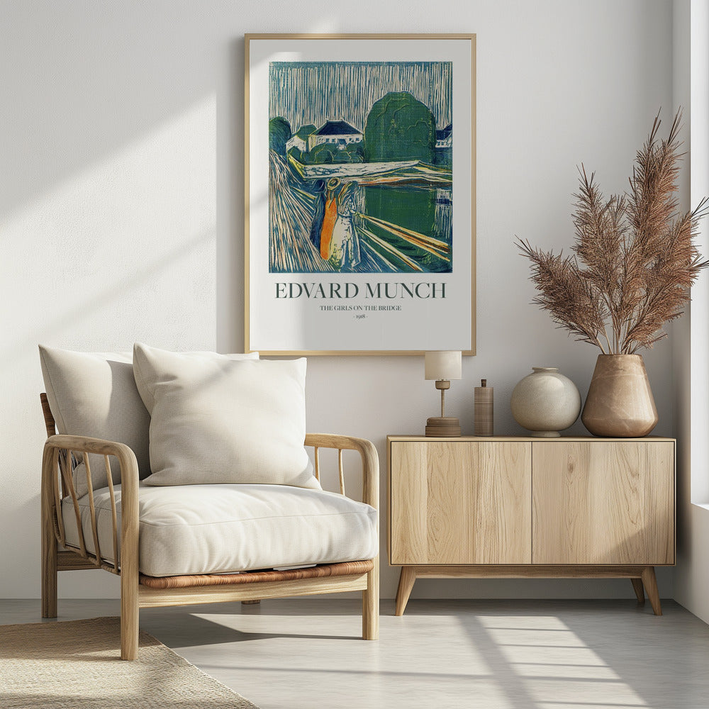 A framed poster of Edvard Munch's 1918 woodcut 'The Girls on the Bridge'. The expressionist artwork depicts three women on a bridge in a vibrant palette of green, blue, and orange, with a village scene in the background. Print