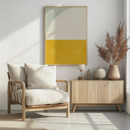 A minimalist abstract art print in a black frame. The design is color-blocked, with the bottom half a solid, textured mustard yellow. The top half is off-white, with a large white arc curving in from the top left corner, which is a pale sage green. Decor