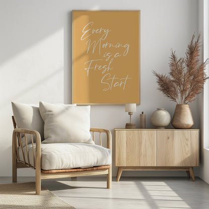 A motivational poster with a mustard yellow background and a thin black frame. The text 'Every Morning is a Fresh Start' is written in a delicate, white, cursive script. Wall Art
