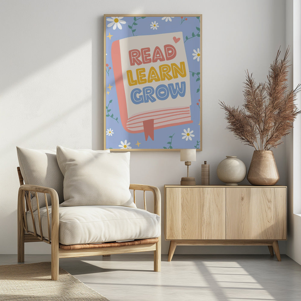 A cheerful illustration of an open book with the words 'READ LEARN GROW' written in colorful, playful letters. The background is light blue with white daisies, green vines, and yellow sparkles, creating a positive and educational theme. Poster