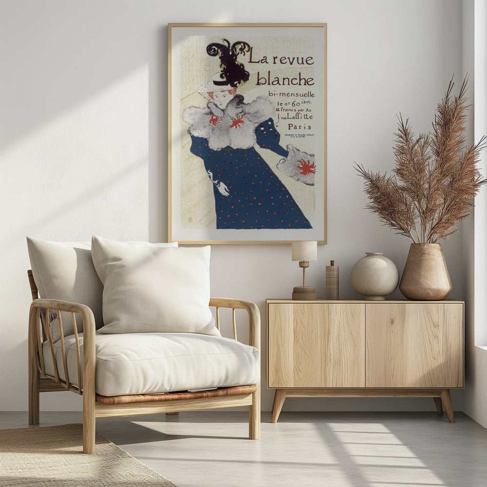 A vintage French poster for 'La revue blanche' by Toulouse-Lautrec. The Art Nouveau illustration features a stylish woman in a blue dress with red polka dots, a large grey fur stole, and a white hat with a prominent black feather plume against a cream background with text. Print