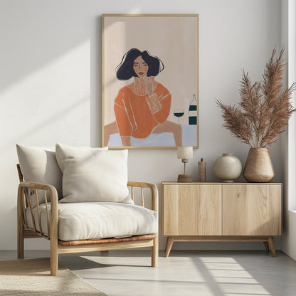 A stylized illustration of a woman with dark wavy hair and red lips, wearing an oversized orange turtleneck sweater. She sits at a light blue table, gazing forward with one hand near her chin. Beside her are a glass and a bottle of wine. The background is a solid cream color. Decor