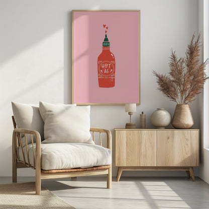 A graphic illustration of a red hot sauce bottle with a green cap on a pink background. The label on the bottle humorously reads 'HOT AF'. Three small red hearts float up from the nozzle, all enclosed within a thin black frame. Wall Art