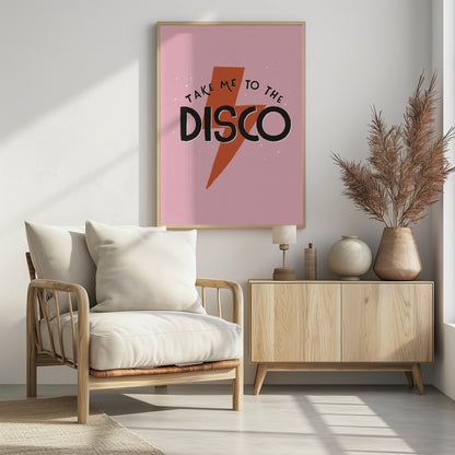 A framed art print with a pink background featuring an orange lightning bolt. The words 'TAKE ME TO THE DISCO' are written in black, with 'DISCO' in a large, bold font. Decor
