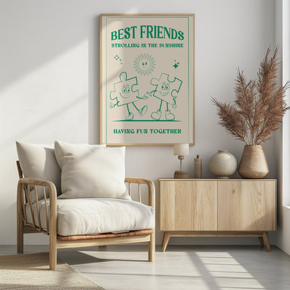 A vintage-style poster with a cream background and green artwork. At the top, it reads 'BEST FRIENDS' and 'STROLLING IN THE SUNSHINE'. The central image shows two smiling cartoon puzzle pieces with arms and legs, walking hand-in-hand under a cheerful cartoon sun. At the bottom, the text says 'HAVING FUN TOGETHER'. The artwork is enclosed in a green border and presented in a black frame. Artwork