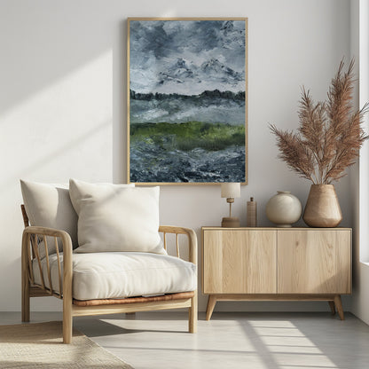 A heavily textured impasto painting of a dramatic mountain landscape under a stormy grey and white sky. Snow-capped peaks rise in the distance above a dark treeline, while a vibrant green field in the foreground provides a splash of color against the otherwise moody, cool-toned scene. The artwork is presented in a simple black frame. Wall Art