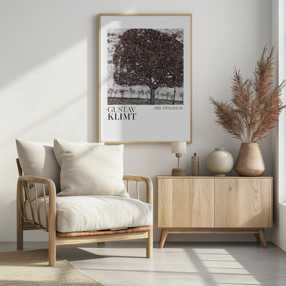 A framed art print of Gustav Klimt's painting 'Der Apfelbaum' (The Apple Tree). The impressionist-style painting depicts a large, full apple tree with a dark, textured canopy dotted with small yellow apples, set against a pale sky and a green meadow. Artwork