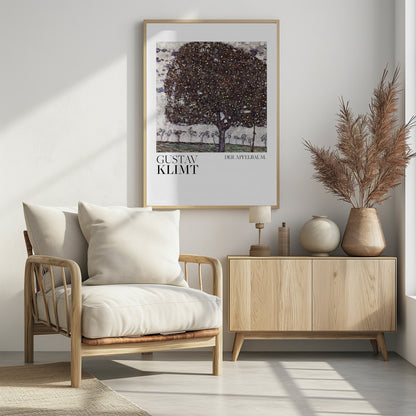 A framed art print of Gustav Klimt's painting 'Der Apfelbaum' (The Apple Tree). The impressionist-style painting depicts a large, full apple tree with a dark, textured canopy dotted with small yellow apples, set against a pale sky and a green meadow. Artwork