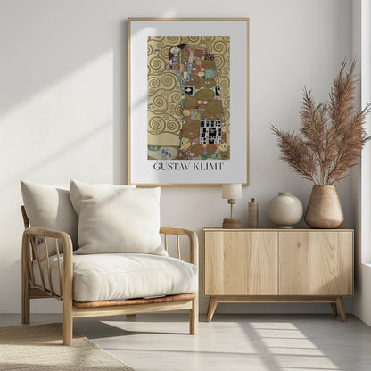A framed art print of Gustav Klimt's painting 'Fulfillment,' featuring a stylized couple embracing. They are enveloped in ornate, patterned robes with geometric and circular motifs, set against a golden background with swirling patterns. The artist's name, 'GUSTAV KLIMT,' is printed below the image. Wall Art