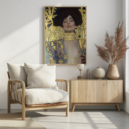A vertical portrait painting by Gustav Klimt, 'Judith and the Head of Holofernes,' depicting a woman with voluminous dark hair and a sensual expression. She wears an elaborate gold and bejeweled choker, with a decorated blue and gold garment falling from her shoulders against a richly patterned gold leaf background. Artwork