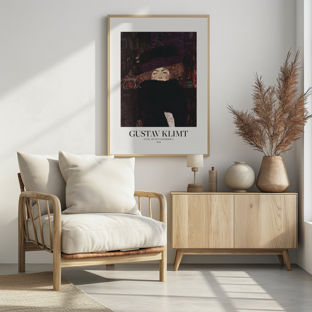 A framed art print of Gustav Klimt's 1909 painting, 'Lady with Hat and Feather Boa'. It features a portrait of a woman with auburn hair, a large purple hat, and a black feather boa obscuring her mouth, set against a dark, textured background. Poster