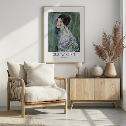 A framed art print poster of Gustav Klimt's "Portrait of a Lady". The painting depicts a woman with dark, upswept hair and blue eyes against a textured green background. The poster includes the text "GUSTAV KLIMT" and "Porträt Einer Dame" below the artwork. Wall Art