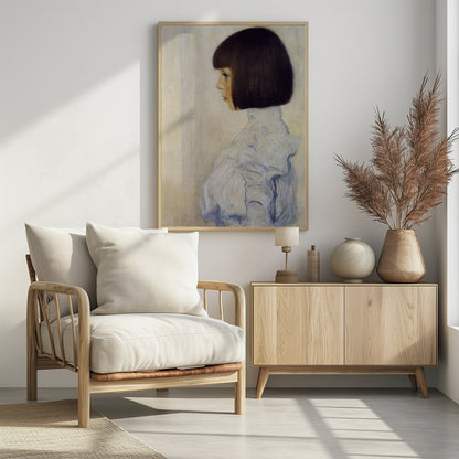 A classic framed portrait painting of a young girl in profile. She has dark brown hair in a sharp bob with bangs and is wearing a high-collared, ruffled light blue blouse against a plain, off-white background. Print