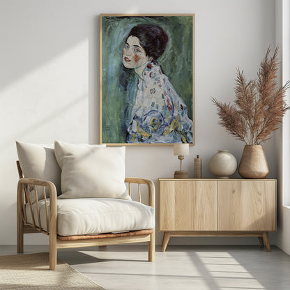 An expressionist portrait painting of a woman with dark hair, blue eyes, and red lipstick, looking back over her shoulder. She wears a patterned dress against a textured green and blue background. The artwork has visible, thick brushstrokes. Artwork