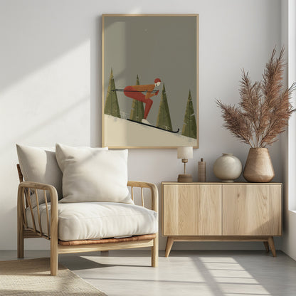 A minimalist illustration of a skier in a red and orange suit, tucked low while skiing down a snowy slope. Stylized green pine trees stand in the background against a muted gray sky with light snowfall, creating a vintage poster aesthetic. Wall Art