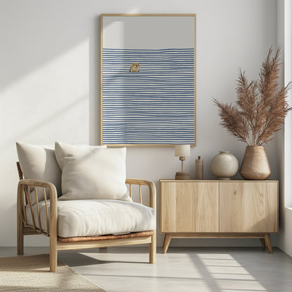 A minimalist illustration in a black frame featuring a cute, smiling otter peeking its head out of stylized water made of wavy, horizontal blue stripes on an off-white background. Decor